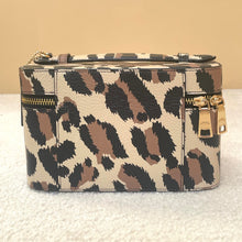 Load image into Gallery viewer, Leopard print handbag with gold accents on a beige background