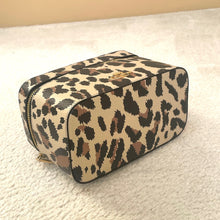 Load image into Gallery viewer, Leopard print cosmetic bag on a textured surface