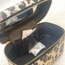 Load image into Gallery viewer, Leopard print makeup bag with a mirror and items inside on a light background