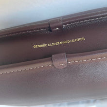 Load image into Gallery viewer, Brown leather wallet with 'Genuine Glovetanned Leather' text on a light background