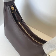 Load image into Gallery viewer, Brown leather handbag with gold zipper on a light background