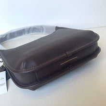 Load image into Gallery viewer, Brown leather bag with visible brand name on a white surface