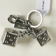 Load image into Gallery viewer, Silver dice charm keychain with chain and Coach tag on a white background