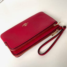 Load image into Gallery viewer, Red wallet with gold zipper and brand logo on a white background