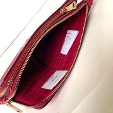 Load image into Gallery viewer, Red handbag with gold zipper on a white background