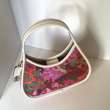 Load image into Gallery viewer, coach leather ergo Heart-shaped handbag with colorful pattern on a white surface