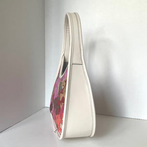 Coach leather White handbag with a colorful floral pattern on a white background