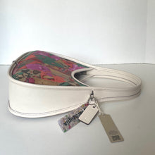 Load image into Gallery viewer, Heart-shaped handbag with floral interior and Coach tag on a white background