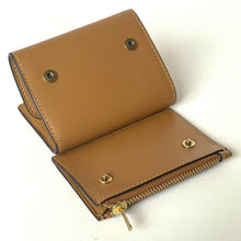 Load image into Gallery viewer, Brown leather wallet with gold zipper and studs on a white background