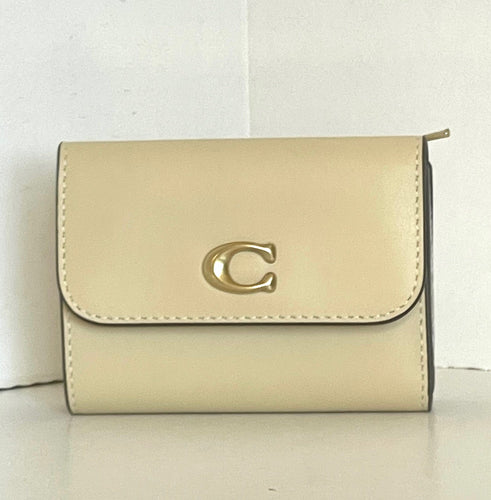 Beige wallet with a gold logo on a white background