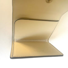 Load image into Gallery viewer, Close-up of a beige Coach wallet with a white background