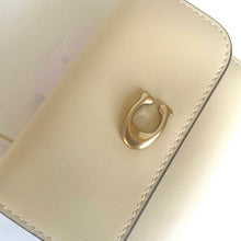 Load image into Gallery viewer, Beige leather wallet with a gold clasp on a light background