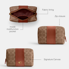 Load image into Gallery viewer, Brown toiletry bag with fabric lining, zip closure, and signature canvas material on a white background.