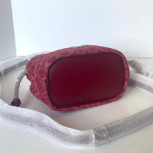 Load image into Gallery viewer, Red neck pillow with floral pattern on a white surface