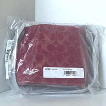 Load image into Gallery viewer, Red wallet with circular pattern in clear plastic packaging on a white background