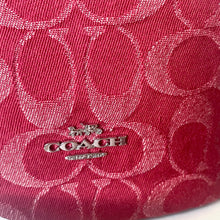 Load image into Gallery viewer, Close-up of a red Coach handbag with a visible logo.
