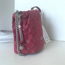 Load image into Gallery viewer, Red handbag with silver chain and Coach tag on a white surface