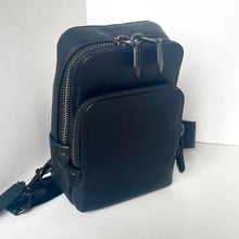 Load image into Gallery viewer, Navy blue leather crossbody bag with a visible brand logo on a white background