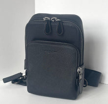 Load image into Gallery viewer, Black leather crossbody bag with multiple zippers on a white background