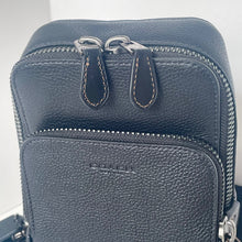 Load image into Gallery viewer, Black leather bag with multiple zippers on a white background