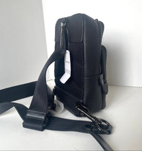 Load image into Gallery viewer, Black leather bag with a strap on a white background