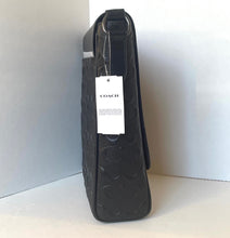 Load image into Gallery viewer, Black Coach wallet with a visible tag on a white background