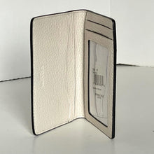 Load image into Gallery viewer, White textured cardholder with brand label on a white background