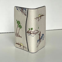 Load image into Gallery viewer, Beige leather wallet with beach-themed illustrations on a white background