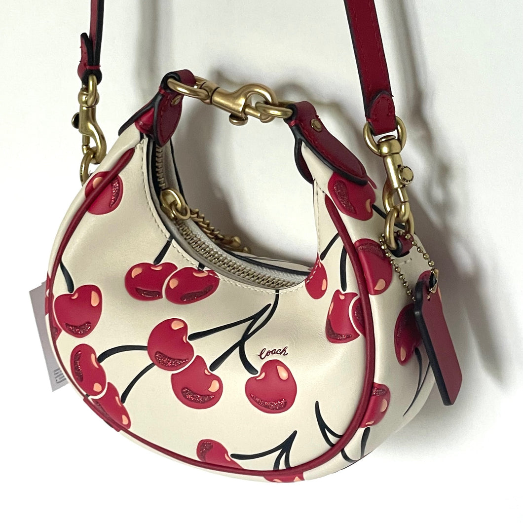 Handbag with cherry design on a white background