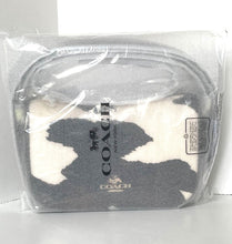 Load image into Gallery viewer, Coach pouch with white and black pattern in clear packaging on a white background