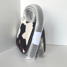 Load image into Gallery viewer, Cow print slipper with gray fuzzy cover on a white background