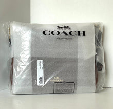 Load image into Gallery viewer, Coach New York product wrapped in plastic on a white background