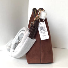 Load image into Gallery viewer, Brown handbag with a gray sweater inside on a white surface