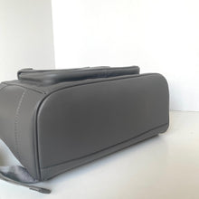 Load image into Gallery viewer, Gray leather bag on a white surface with a white background