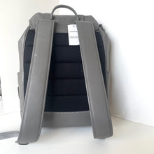 Load image into Gallery viewer, Gray backpack with a visible Coach tag on a white background
