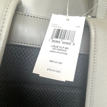 Load image into Gallery viewer, Close-up of a gray bag with a price tag showing $850.00 USD and $790.00 CAD.