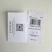 Load image into Gallery viewer, Coach product tag with barcode and price on a light gray background
