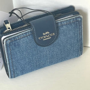 Blue Coach wallet on a white background