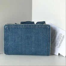 Load image into Gallery viewer, Blue denim wallet on a light gray surface with a white background