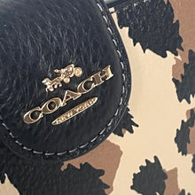 Load image into Gallery viewer, Black Coach handbag with gold logo on a camouflage background
