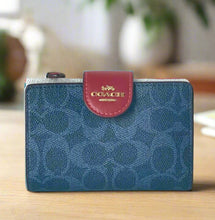 Load image into Gallery viewer, Blue Coach wallet with a red flap on a white background