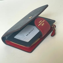 Load image into Gallery viewer, Open wallet with red interior and gray exterior on a white background
