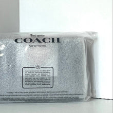 Load image into Gallery viewer, Coach New York pouch in clear packaging on a white background