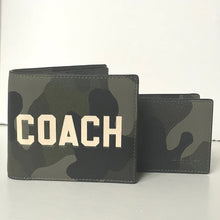 Load image into Gallery viewer, Camouflage-patterned wallet with 'COACH' branding on a white background