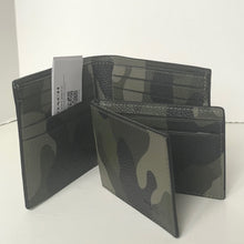 Load image into Gallery viewer, Camouflage-patterned wallet with a visible brand tag on a white background