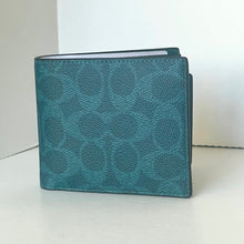 Load image into Gallery viewer, Teal wallet with a pattern on a white background