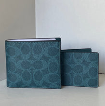 Load image into Gallery viewer, Two teal patterned wallets on a light gray surface with a white background