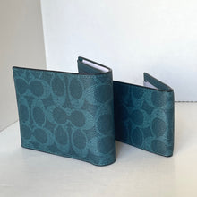 Load image into Gallery viewer, Teal patterned wallet on a white surface with a white background