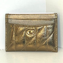 Load image into Gallery viewer, Gold metallic wallet with a brand logo on a white background