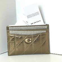 Load image into Gallery viewer, Gold cardholder with brand logo on a white background